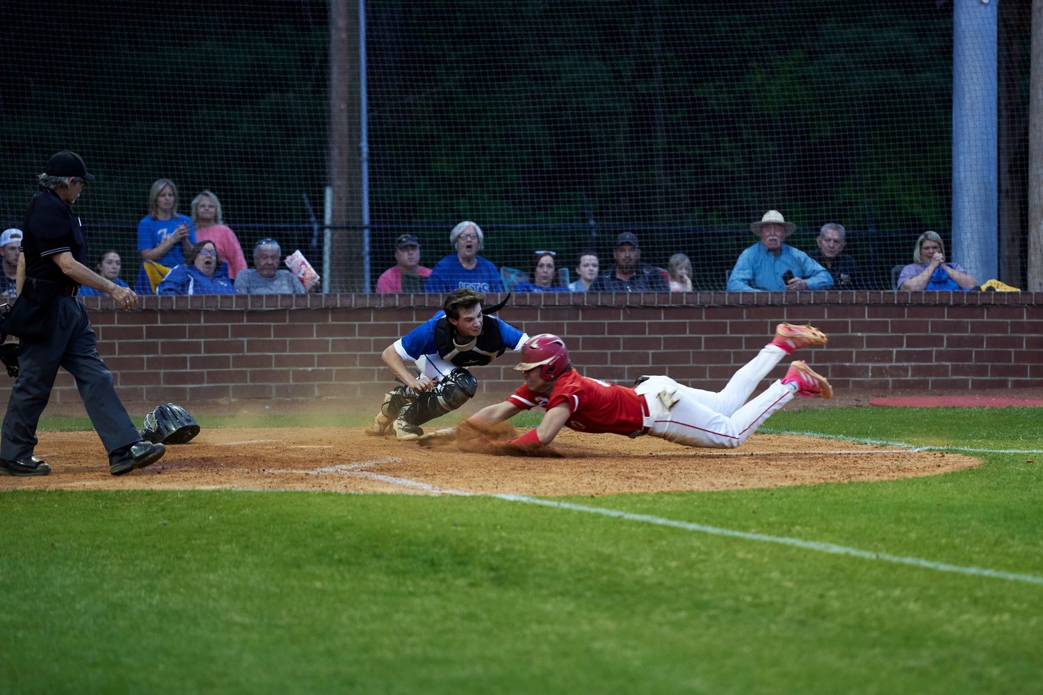 A Chatham Central player attempts to avoid a tag from Jordan-Matthews catcher Mason Phillips in the Bears' 4-3 win over the Jets on Thursday.